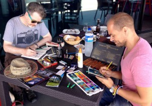 Victor vive en Tenerife, pero vuelve con frecuencia por la Isla de La Palma: El foto ensena Victor y Steve Simpson pintando al proyecto #Onthedraw en verano 2014. Siete illustradores estuven en siete islas del archipiélgao illustrando sus impresiones - ahora las obras son visible en exhibiciones en todo el mundo. Foto: Onthedraw